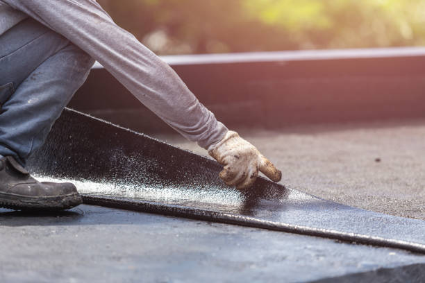 Professional Waterproofing technician working in Little River, KS